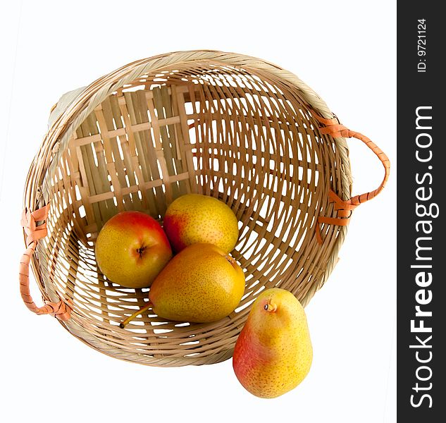 Still life of a few pears in a rattan basket isolated on white background with clipping path. Still life of a few pears in a rattan basket isolated on white background with clipping path