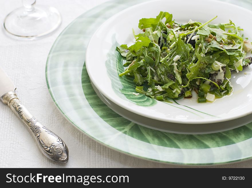 Plate of fresh green salad with rocket