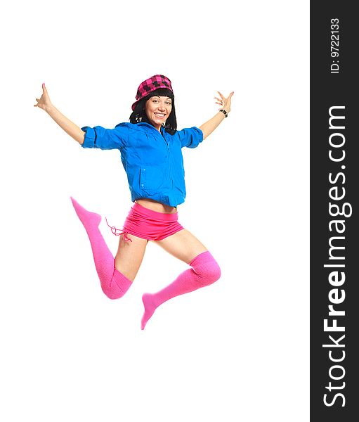 Studio portrait of a happy jumping girl wearing colorful clothes