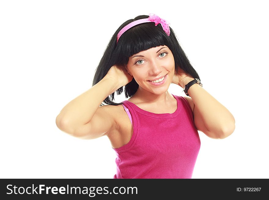 Studio portrait of a beautiful brunette girl wearing pink clothes