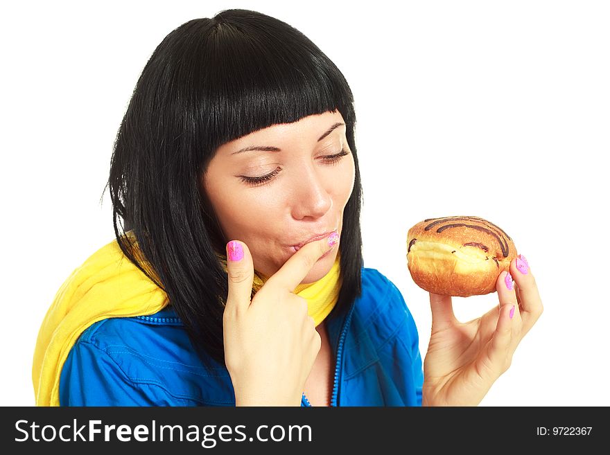 Girl eating a roll with chocolate