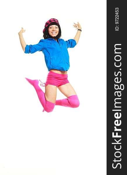 Studio portrait of a happy jumping girl wearing colorful clothes