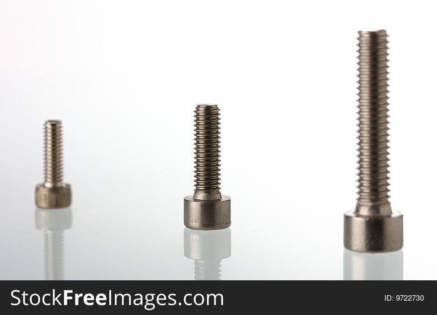 Macro of screws on bright background