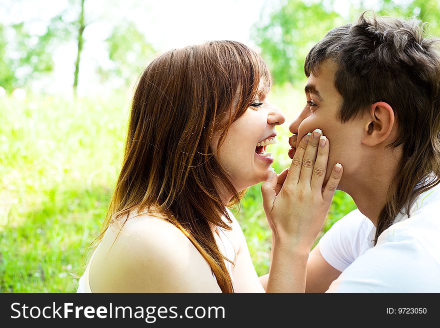 Happy young couple having fun in summer park. Happy young couple having fun in summer park