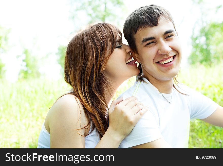 Happy young couple having fun in summer park. Happy young couple having fun in summer park