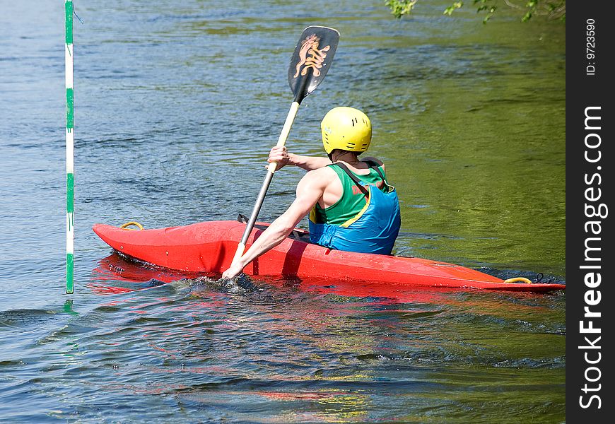 Image of the kayaker with an oar on the water