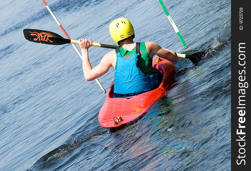 Image of the kayaker with an oar on the water