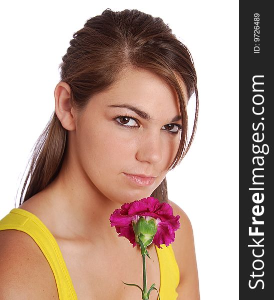 A pretty young woman holding a pink flower. A pretty young woman holding a pink flower.