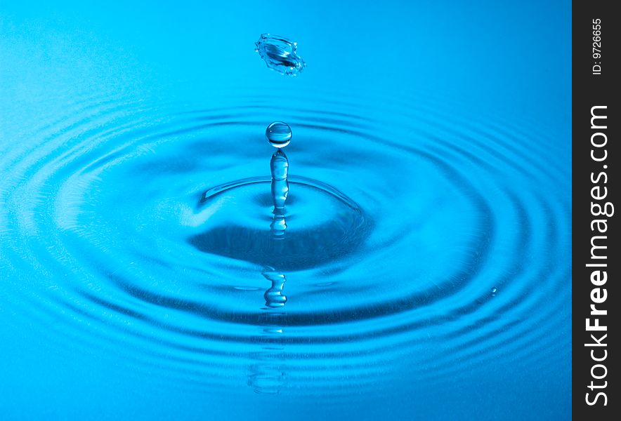 Blue water drop captured in high speed. Blue water drop captured in high speed