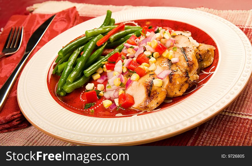 Grilled chicken with salsa and green beans. Grilled chicken with salsa and green beans