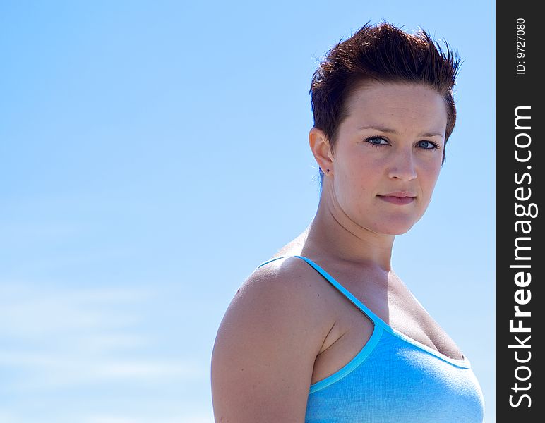 Beautiful Woman at the Beach looking at the camera