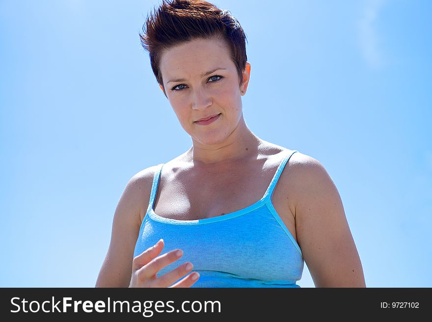 Beautiful Woman at the Beach looking at the camera