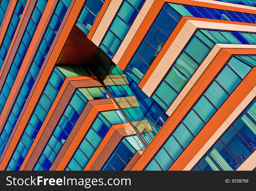 Menzis Office Building, Groningen, Netherlands. Three identical prismatic volumes, each four stories high, are rotated at 90 degrees to one another, so the building seems to lean. Menzis Office Building, Groningen, Netherlands. Three identical prismatic volumes, each four stories high, are rotated at 90 degrees to one another, so the building seems to lean.