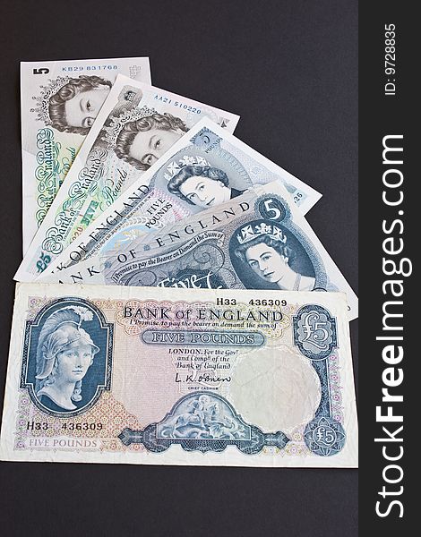 The last five versions of the British five pound note. The last five versions of the British five pound note