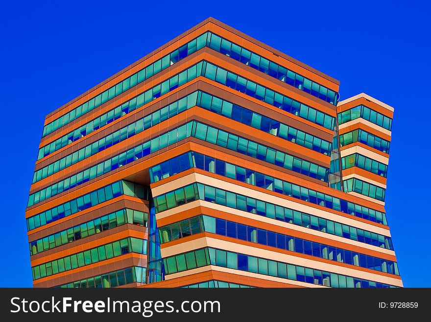 Menzis Office Building, Groningen, Netherlands. Three identical prismatic volumes, each four stories high, are rotated at 90 degrees to one another, so the building seems to lean. Menzis Office Building, Groningen, Netherlands. Three identical prismatic volumes, each four stories high, are rotated at 90 degrees to one another, so the building seems to lean.