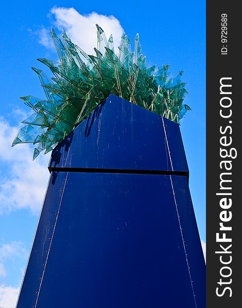 Architectual bridge of metal and glass on a background of a blue sky. Architectual bridge of metal and glass on a background of a blue sky