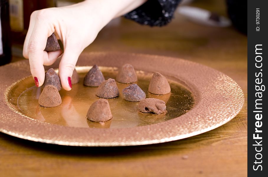 Pralines served on gold plate