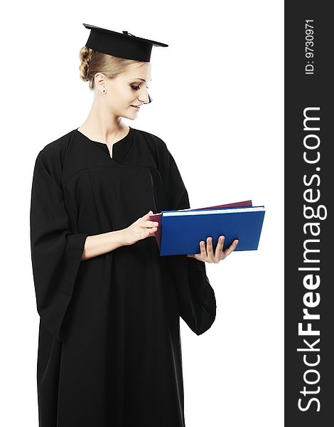 Portrait of a young woman in an academic gown. Educational theme. Portrait of a young woman in an academic gown. Educational theme.