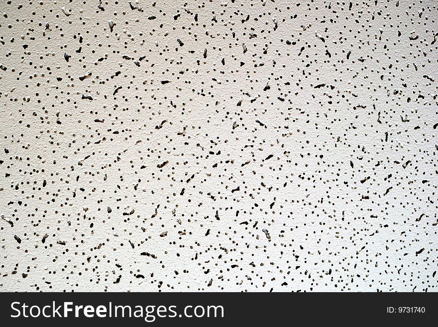 Office overhead ceiling panel texture. Some holey material