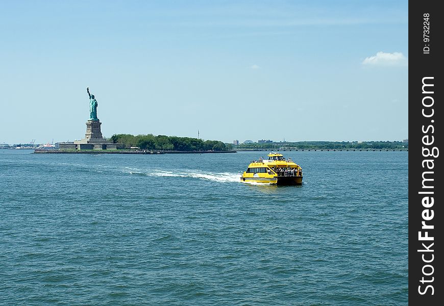 Statue of Liberty and Taxi coming from it.