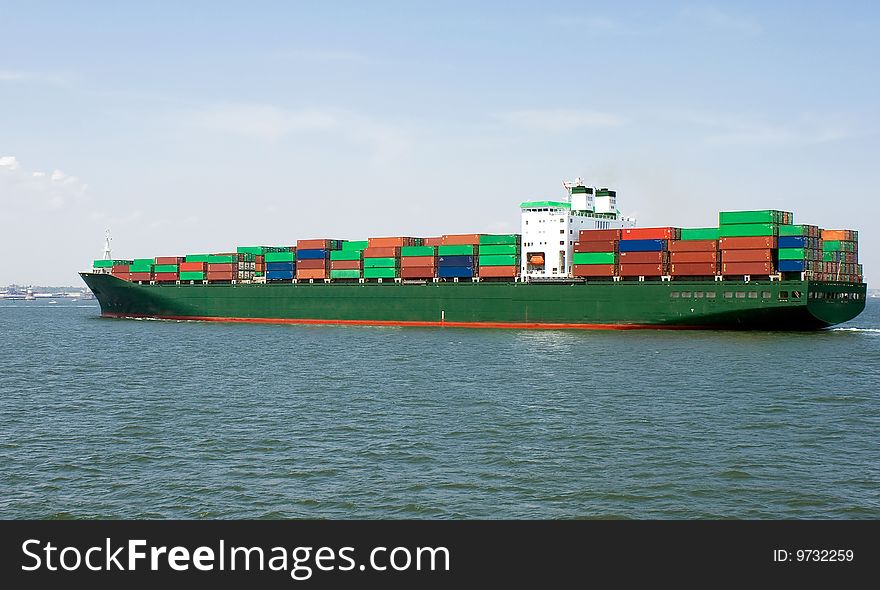 View of a ship loaded with containers. View of a ship loaded with containers.