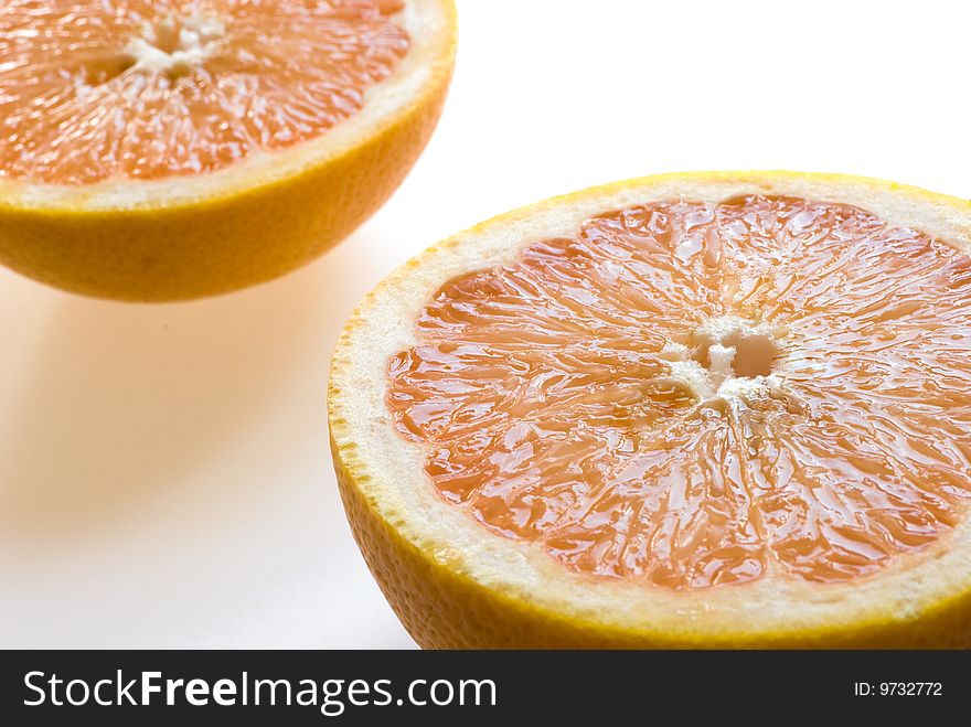 Ripe grapefruits on white background