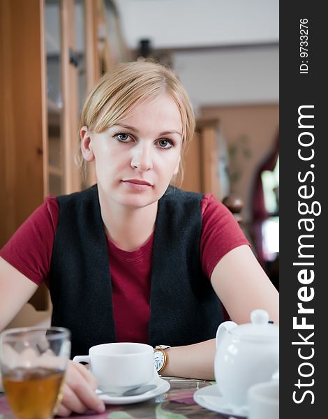 Beautiful girl behind a table in cafe. Beautiful girl behind a table in cafe