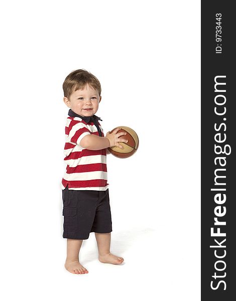 Little boy with basket ball on white background