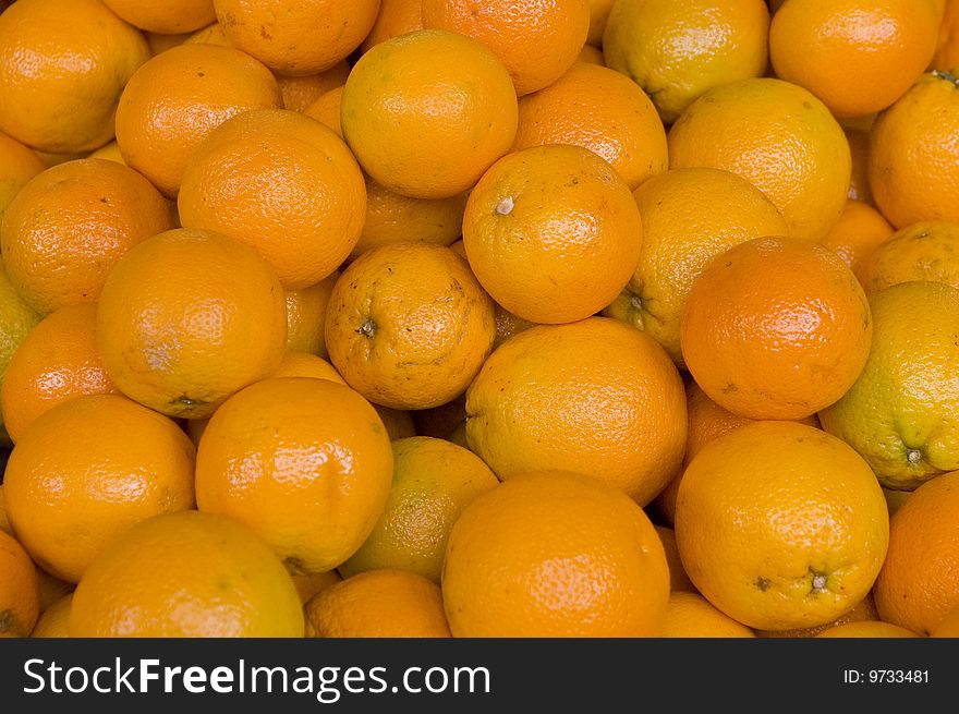 A lot of orange fruits. A lot of orange fruits