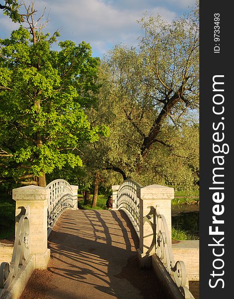 Old pedestrian bridge in a town park