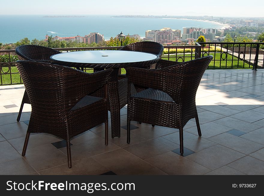 Table and chairs at restaurant with a kind on the black sea