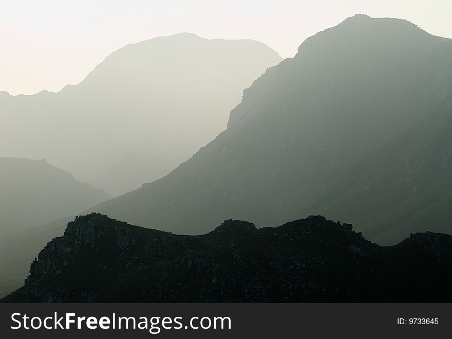 Silhouette of misty mountain range. Silhouette of misty mountain range