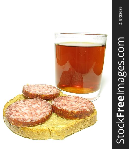 Fast food, a cup of tea and a sandwich with sausage on a white background. Fast food, a cup of tea and a sandwich with sausage on a white background.