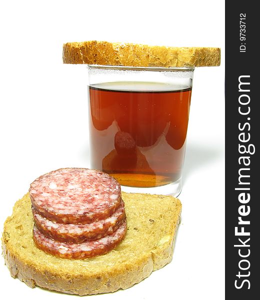 Fast food, a cup of tea and a sandwich with sausage on a white background. Fast food, a cup of tea and a sandwich with sausage on a white background.