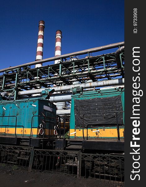 A train under 2 chimneyes at Capital Iron and Steel Plant in Beijing,China,Asia. A train under 2 chimneyes at Capital Iron and Steel Plant in Beijing,China,Asia.