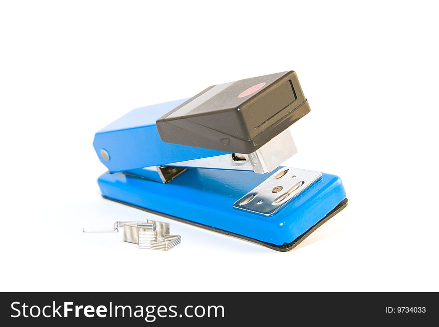 Single blue,chrome and black stapler with staples on a white background