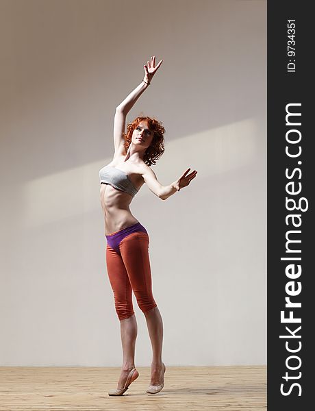 Modern style dancer posing on studio background. Modern style dancer posing on studio background