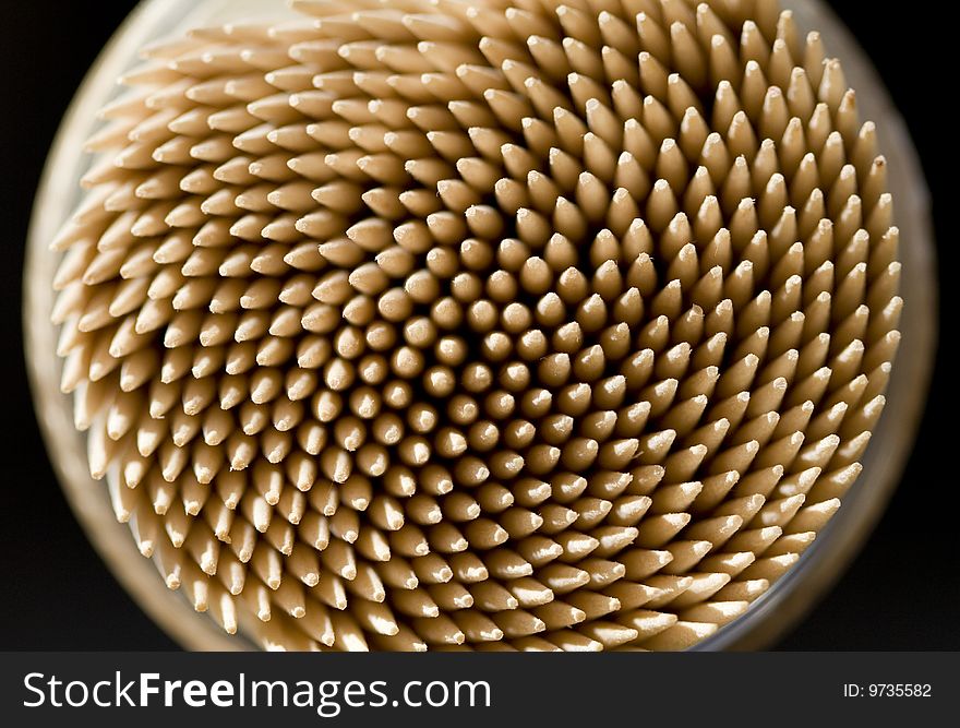 Close up of toothpick on a black background