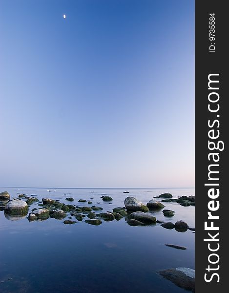 Baltic seaside after sunset with moon