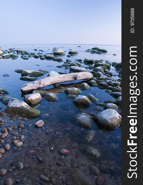 Baltic seaside with stones after sunset