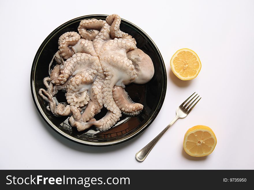 Octopus on a black dish