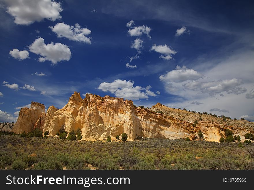 View of the red rock formations in  Grand Staircase Escalante National Monument with blue skyï¿½s and clouds