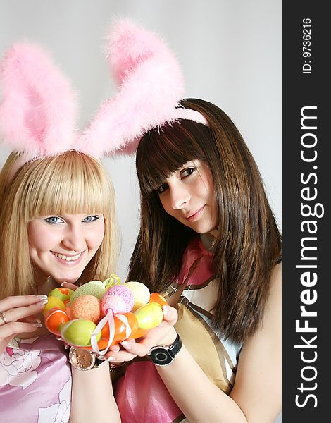 Girl with rabbit ears smiling.