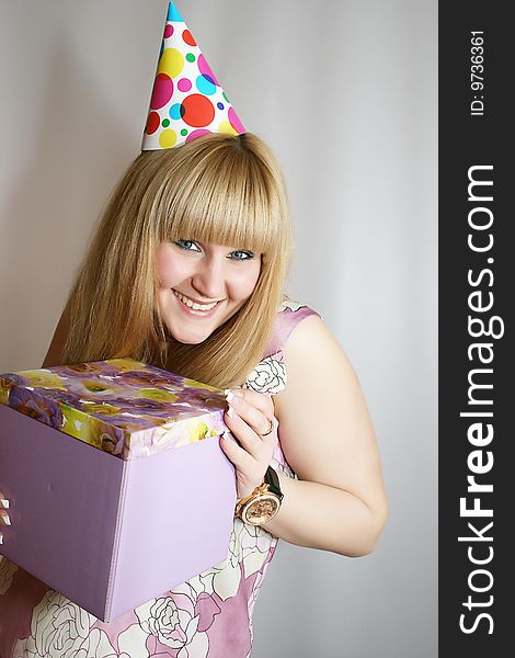 Young blond girl with present close up shoot