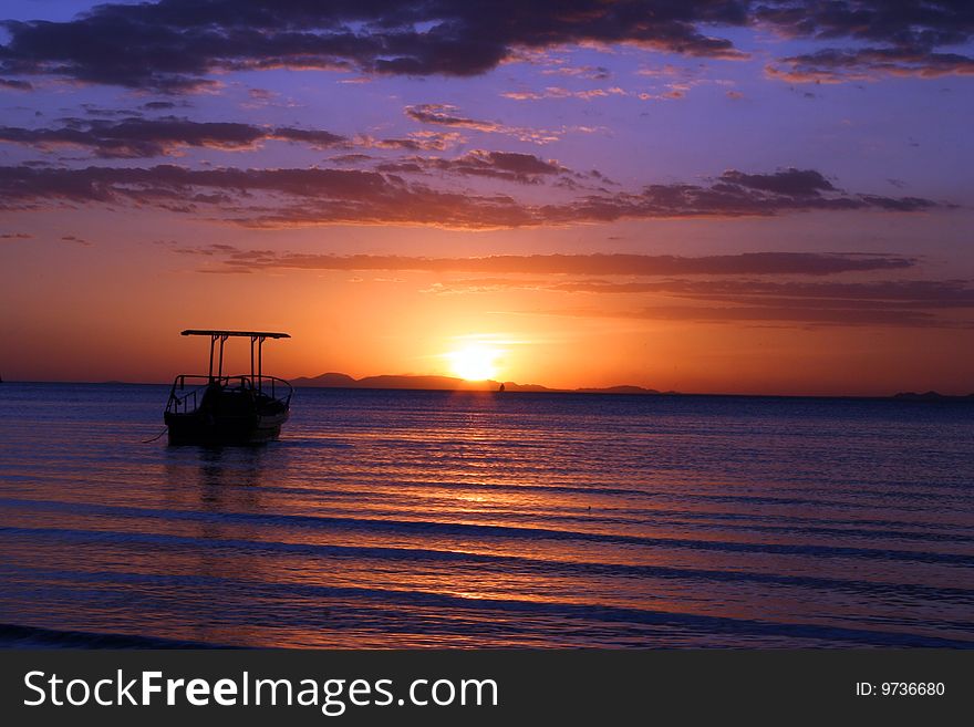 Boat in sunset on a beach