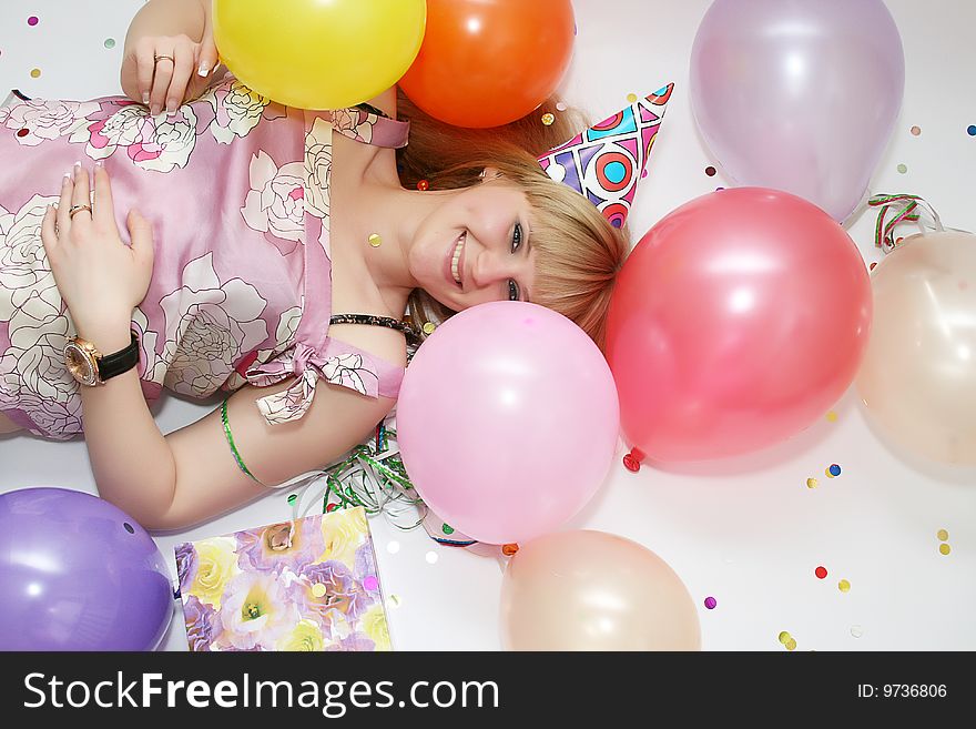 Young pretty woman in birthday cap