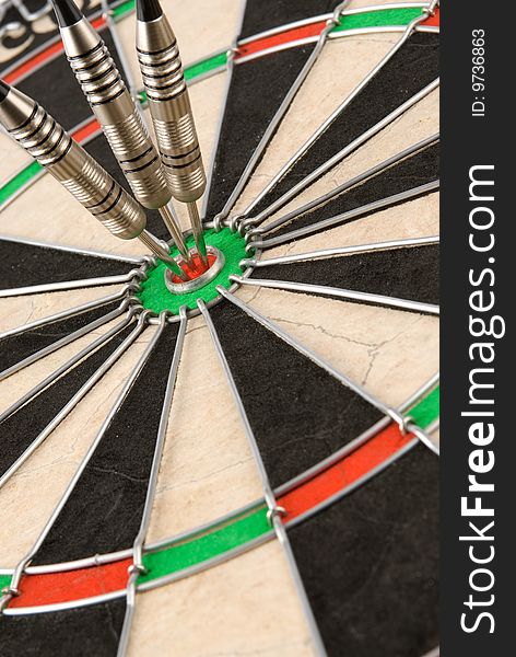 Closeup darts board with arrows