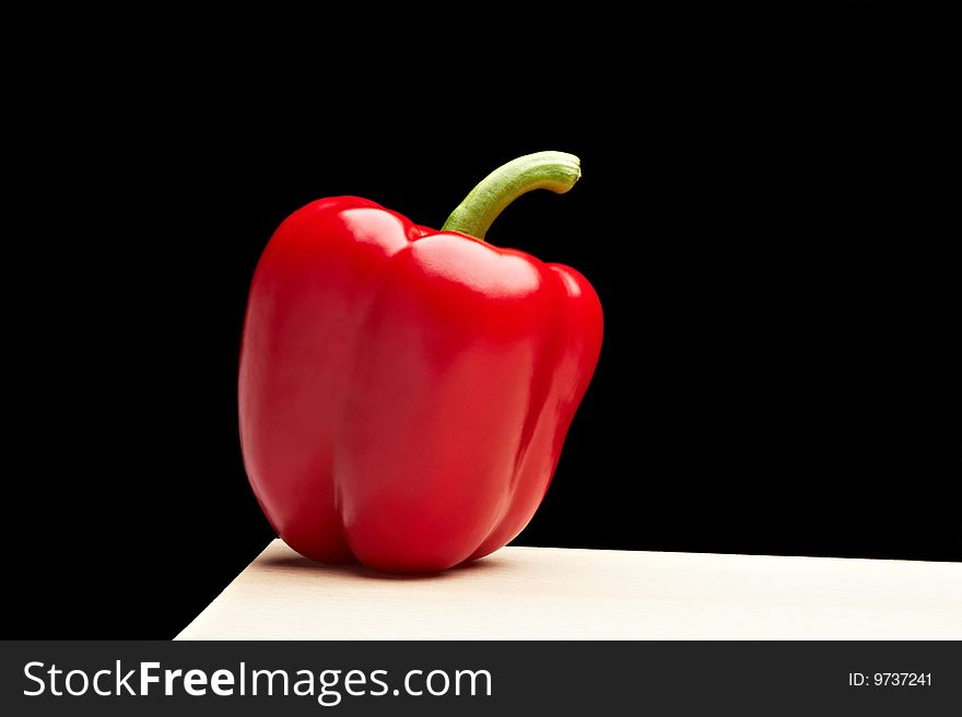 Isolated red pepper on black background. Isolated red pepper on black background