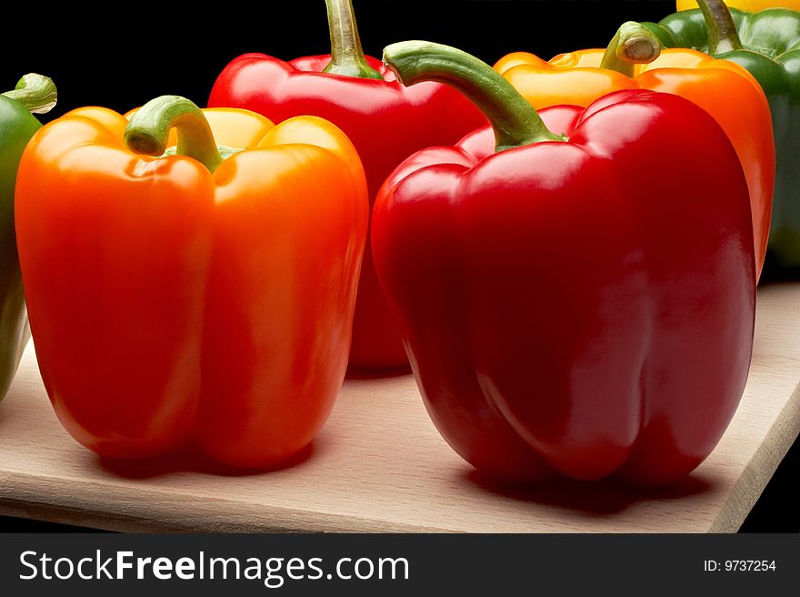 Vegetables - Peppers on cutting board. Vegetables - Peppers on cutting board