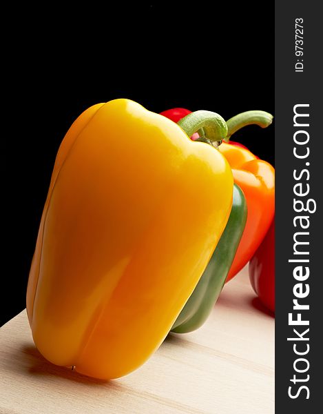 Vegetables - Peppers on black background. Vegetables - Peppers on black background